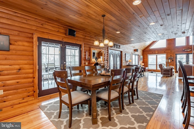 dining area featuring wood ceiling, light hardwood / wood-style floors, lofted ceiling, and a wealth of natural light