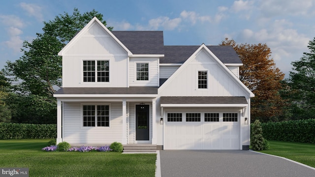 view of front of property featuring a front lawn and a garage