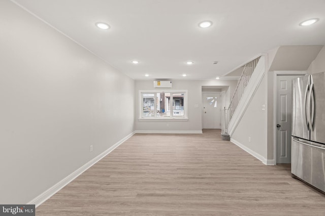 unfurnished living room featuring light hardwood / wood-style flooring