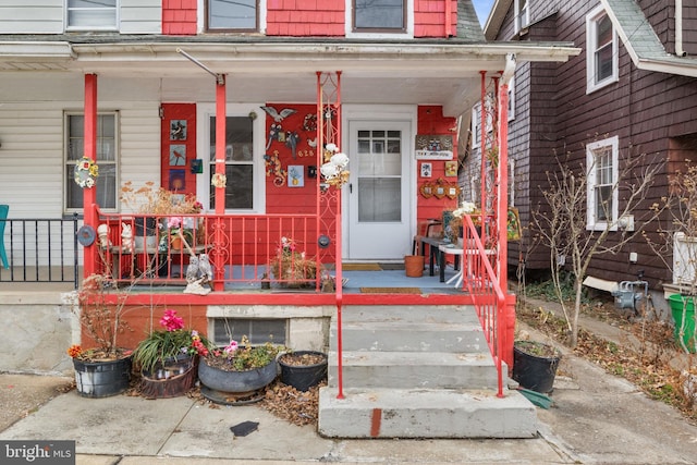 doorway to property featuring covered porch