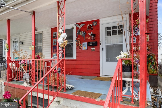 doorway to property featuring a porch