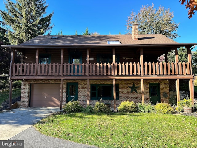 log-style house featuring a balcony, a garage, and a front lawn