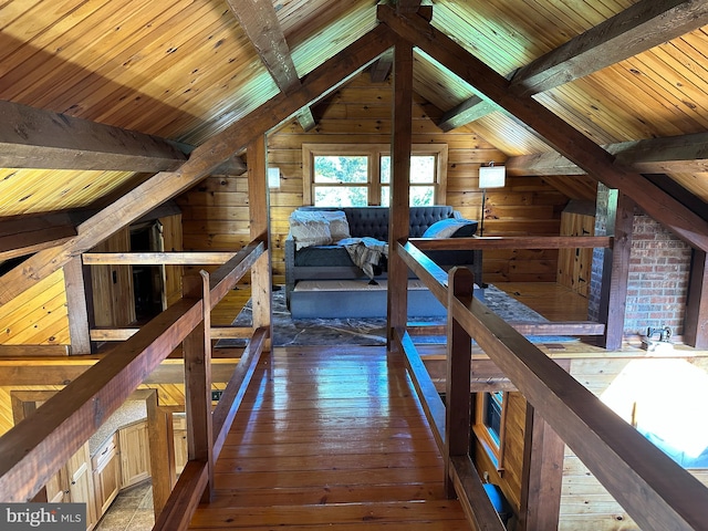 corridor with lofted ceiling with beams, dark hardwood / wood-style floors, wood ceiling, and wood walls