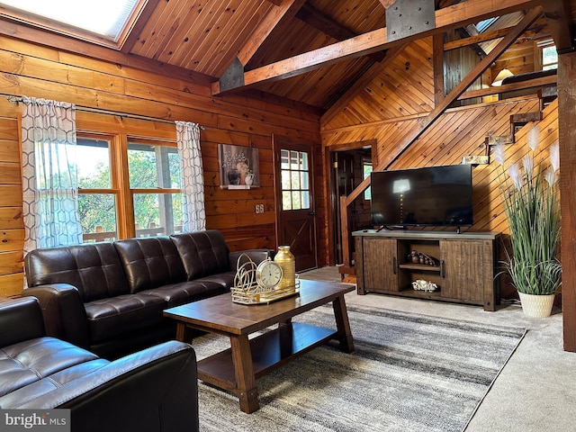 living room with wood walls, wood ceiling, and high vaulted ceiling