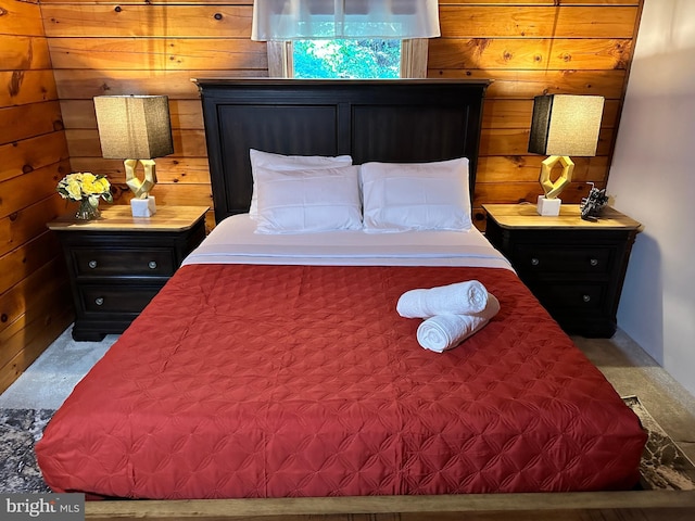 bedroom with wood walls