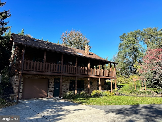 view of front of house with a balcony and a garage