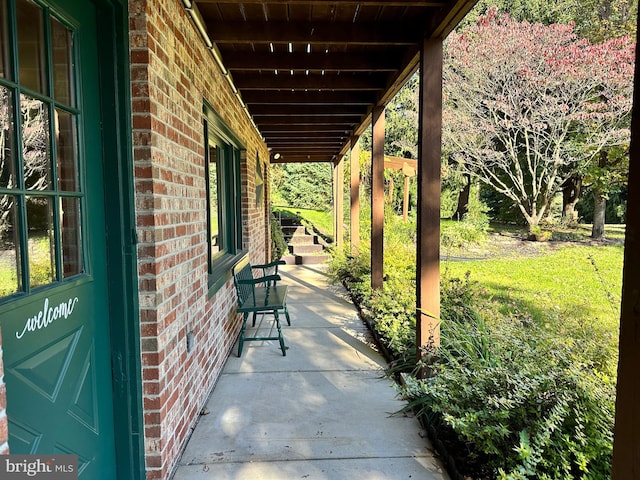 view of patio featuring a porch