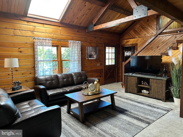 carpeted living room with a skylight, a wealth of natural light, wooden walls, and wood ceiling