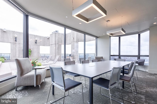 dining area with floor to ceiling windows