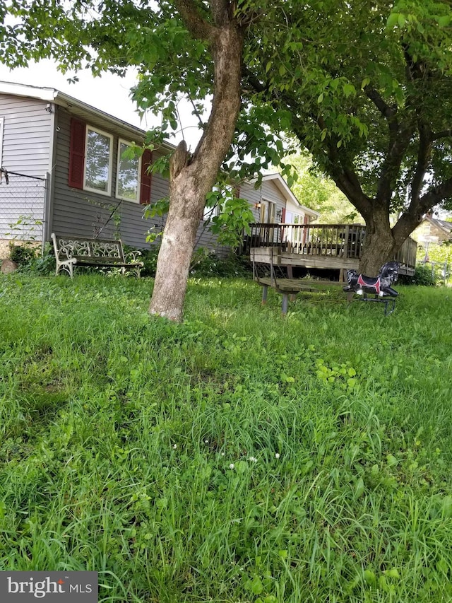 view of yard featuring a wooden deck