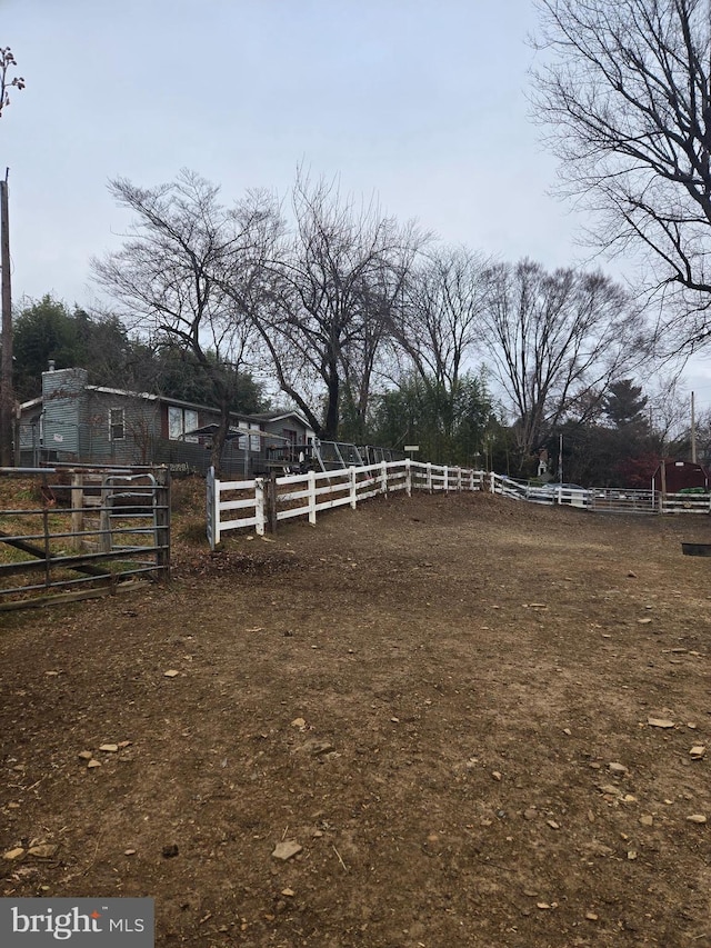 view of yard with a rural view