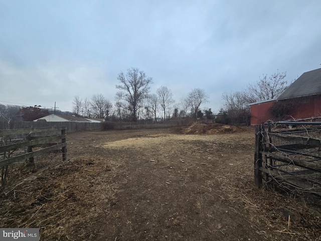 view of yard with a rural view