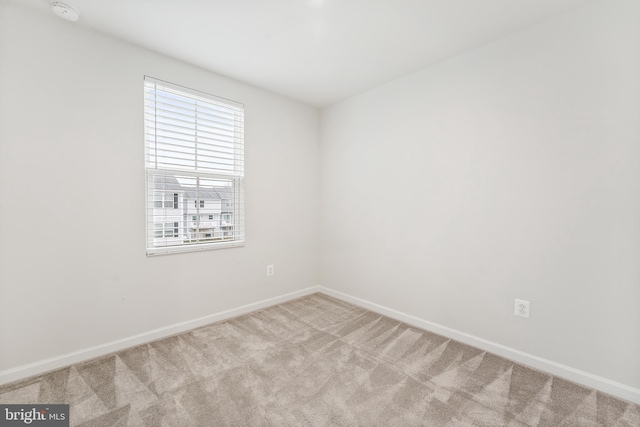 empty room featuring light carpet