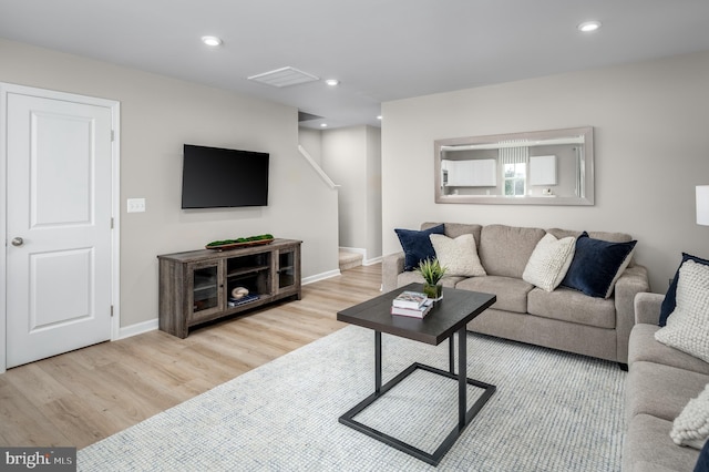 living room with light hardwood / wood-style flooring