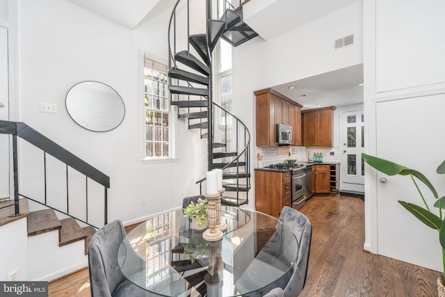 dining area featuring dark hardwood / wood-style flooring