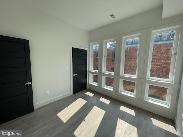 empty room featuring hardwood / wood-style flooring