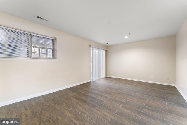 empty room featuring dark hardwood / wood-style floors