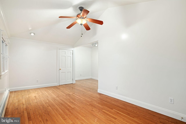 empty room featuring ceiling fan, a baseboard radiator, light wood-type flooring, lofted ceiling, and ornamental molding