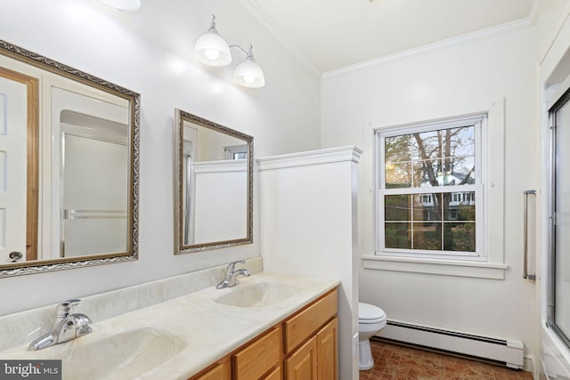 bathroom with vanity, toilet, ornamental molding, and a baseboard heating unit