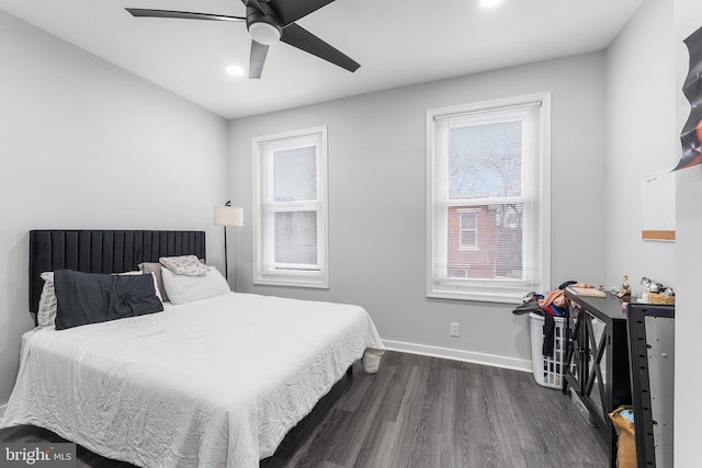 bedroom with ceiling fan and dark hardwood / wood-style floors