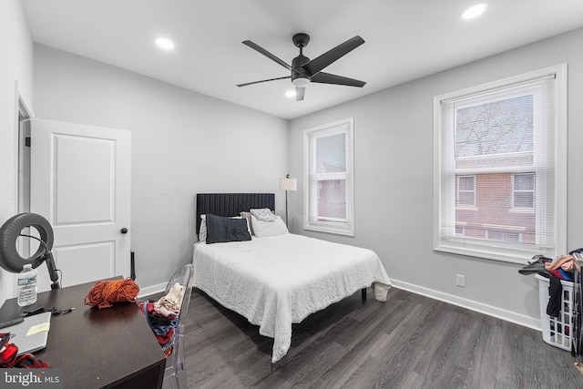 bedroom featuring dark hardwood / wood-style flooring and ceiling fan