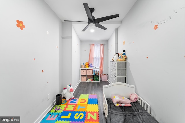 bedroom featuring dark hardwood / wood-style flooring and ceiling fan