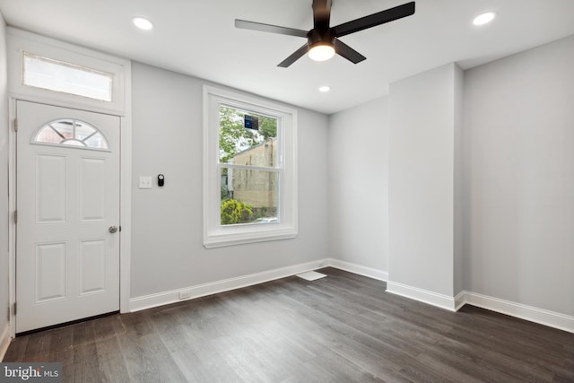 entryway with dark hardwood / wood-style flooring and ceiling fan