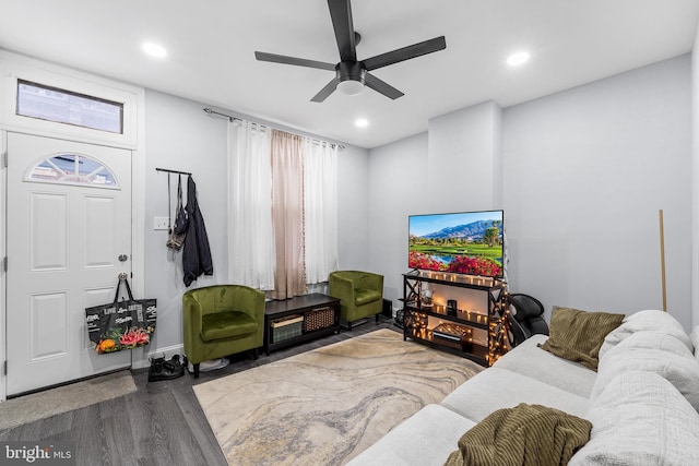 living room with ceiling fan and hardwood / wood-style floors