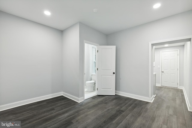 empty room with dark wood-type flooring