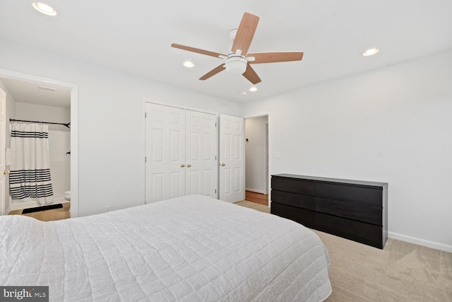 bedroom with ceiling fan and light colored carpet