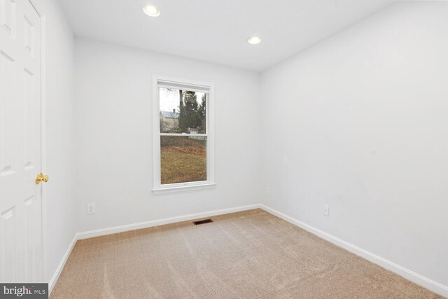 view of carpeted spare room