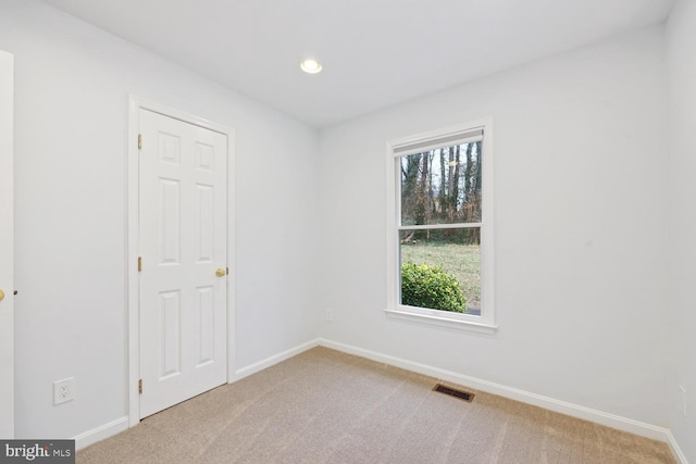 spare room with carpet floors