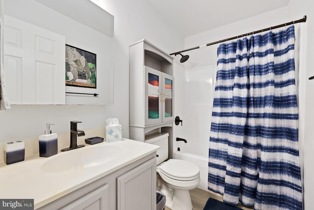 full bathroom featuring hardwood / wood-style floors, vanity, toilet, and shower / bath combination with curtain