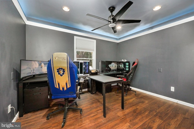 office area featuring ceiling fan, crown molding, and dark wood-type flooring