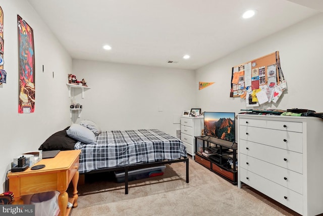 bedroom featuring light carpet