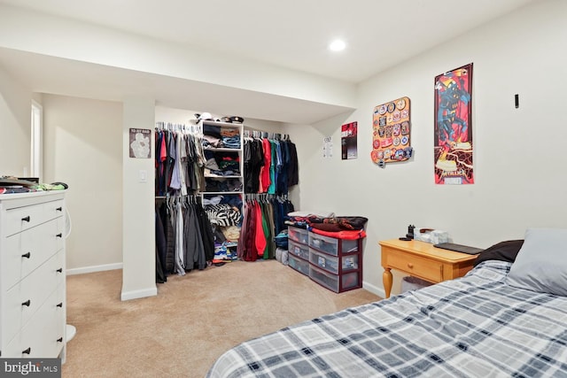 carpeted bedroom with a closet