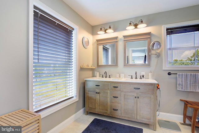 bathroom featuring tile patterned flooring and vanity