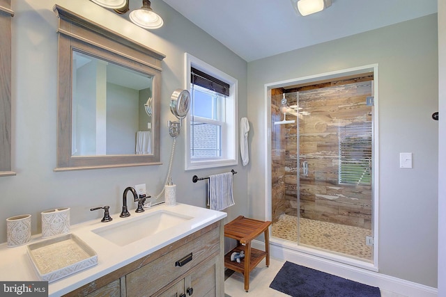 bathroom featuring vanity and a shower with shower door