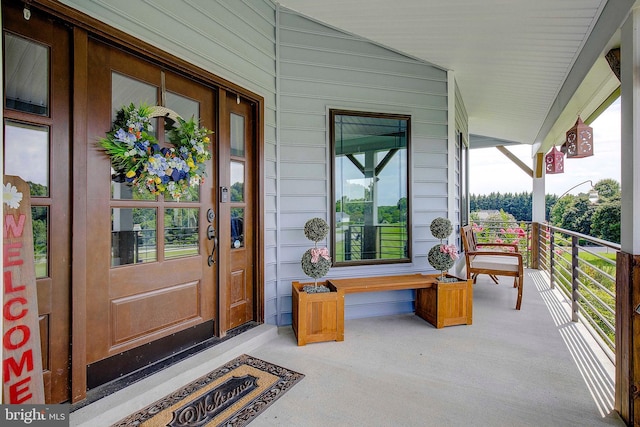 entrance to property featuring a porch