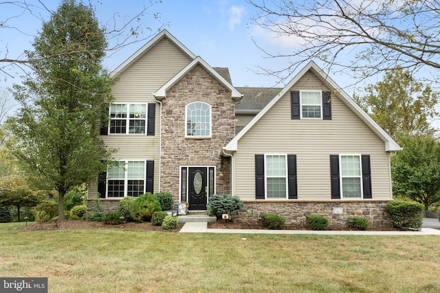 view of front of property with a front lawn