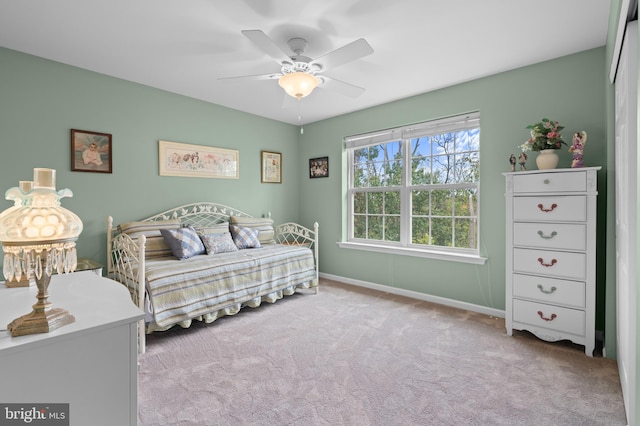 carpeted bedroom with ceiling fan