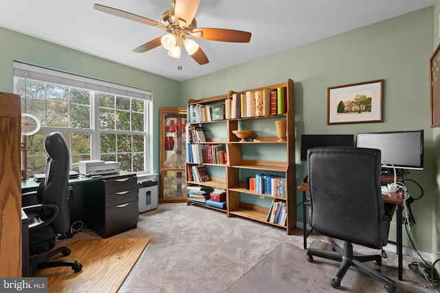 office with ceiling fan and light colored carpet