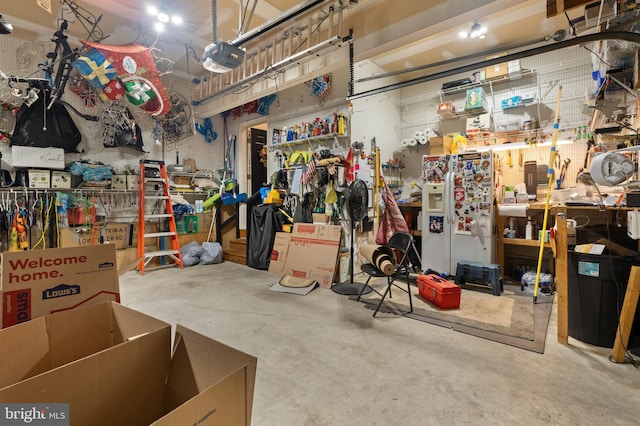 interior space with a workshop area and concrete floors