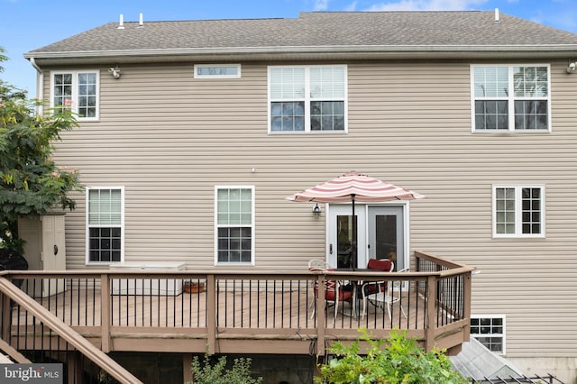 rear view of house with french doors and a deck