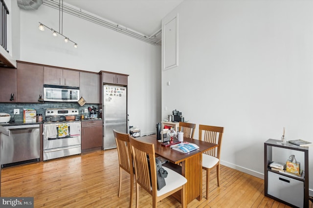 dining area with light wood-type flooring