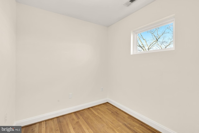 spare room featuring hardwood / wood-style floors