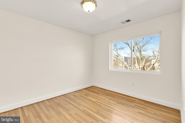 spare room with light hardwood / wood-style floors