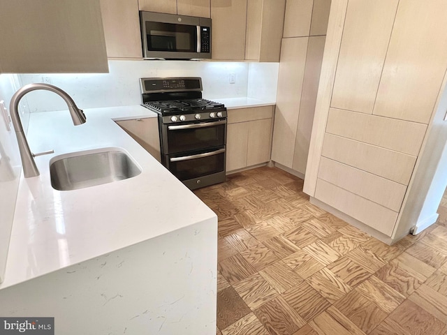 kitchen featuring sink and appliances with stainless steel finishes