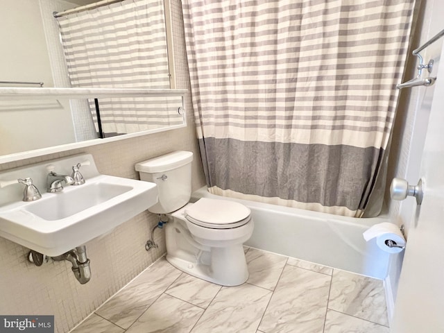 full bathroom with sink, toilet, and shower / tub combo