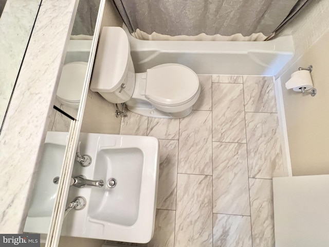 bathroom featuring toilet